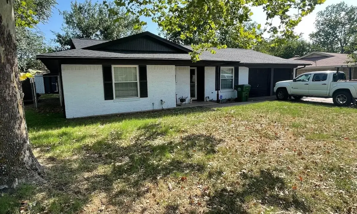 Professional roofing crew working on a residential roof in Camp Springs