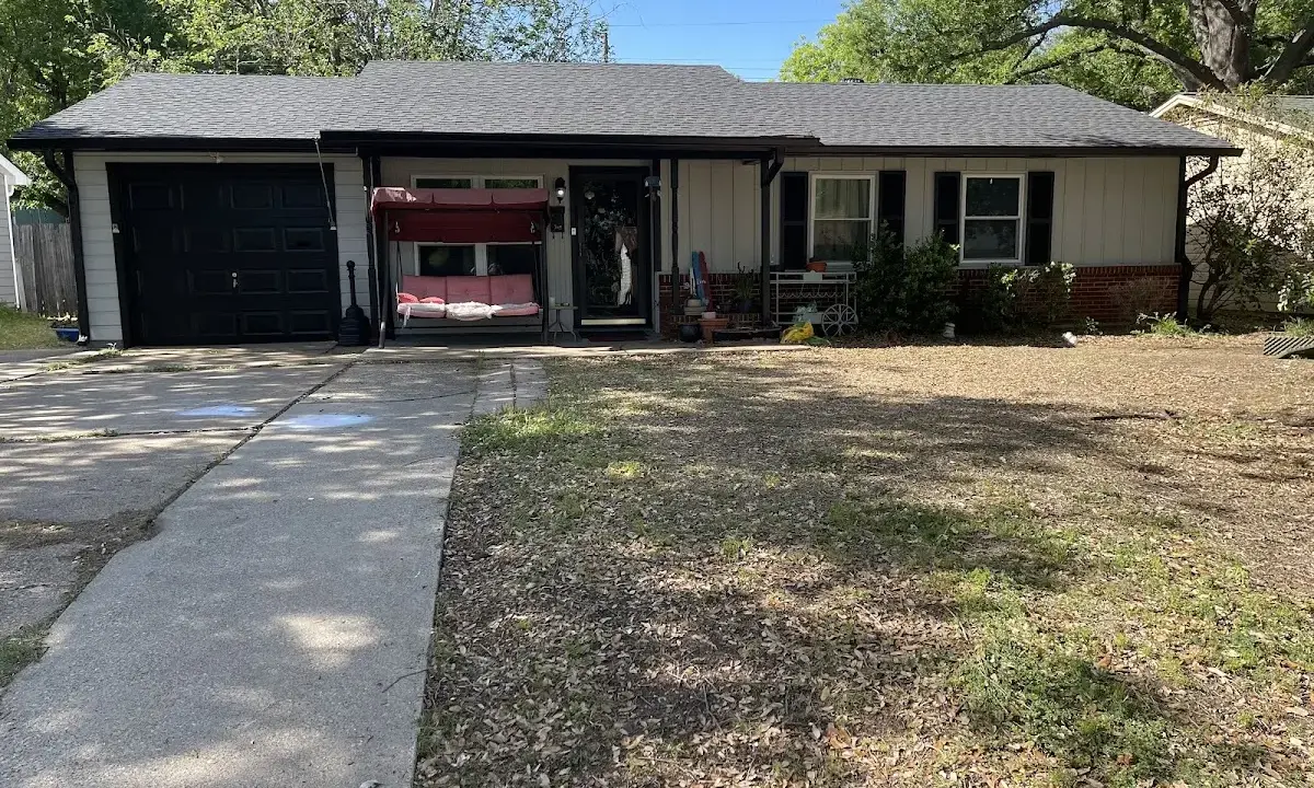 Asphalt Shingle Roof Repair crew at work on a residential roof in Camp Springs